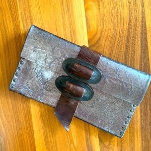 Rebel Designs, Brooklyn. Leather Gunmetal clutch w/ antique brass buckle.